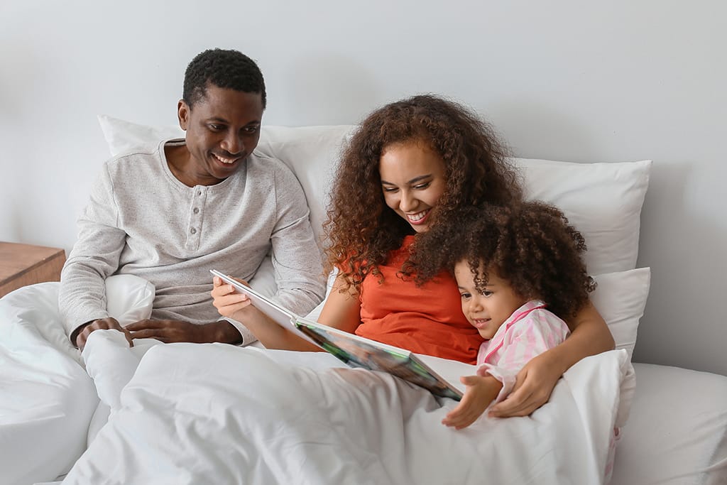 Family reading keepsake book together